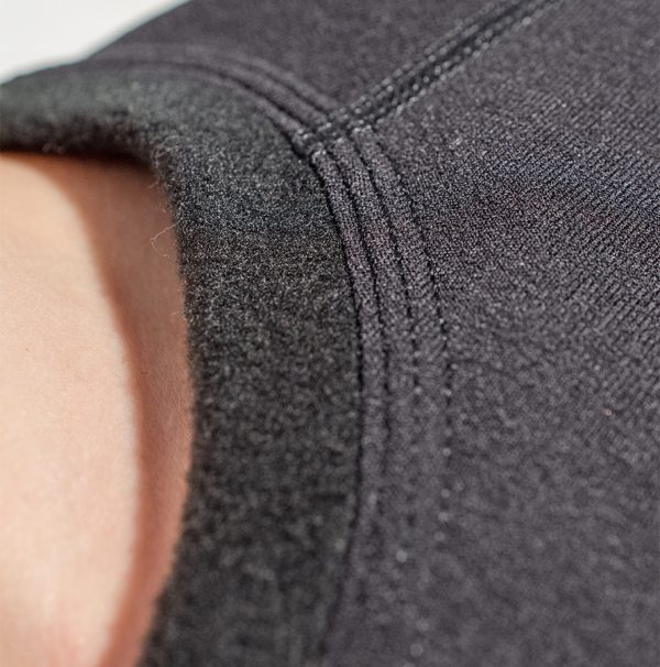 Close up of the neck stitching on the Fourth Element Xerotherm Long Sleeve Top