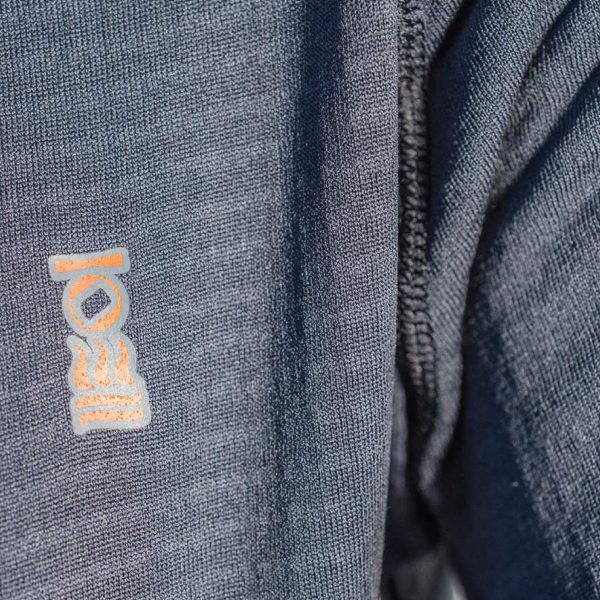 Close up of the logo on the chest of the Men's Fourth Element J2 Baselayer longsleeve top