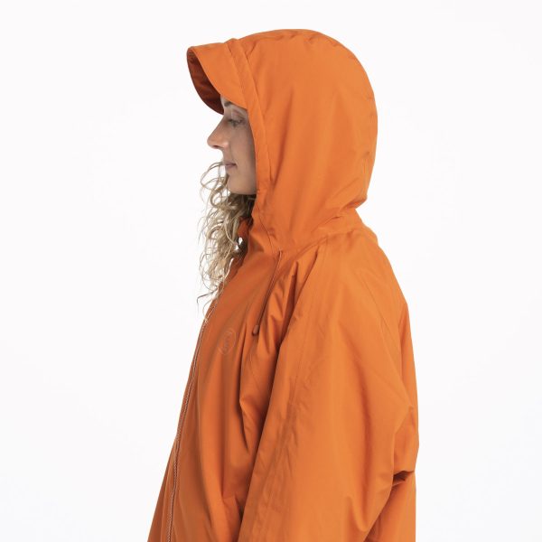 Side view with hood up of the orange Fourth Element Tidal Robe