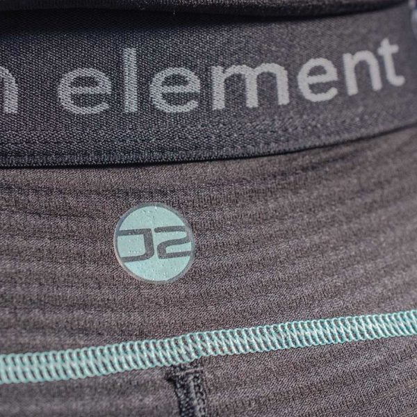 Close up of the logo on the women's Fourth Element J2 Baselayer Leggings